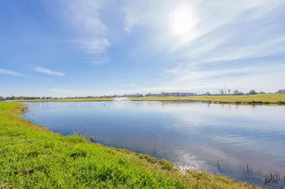 a body of water with the sun in the sky at Green Side Golf 3 B.R Apartment in Marrakech