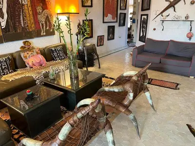 a living room with a couch and a table at Penthouse Jaccuzi Atlas Marrakech in Marrakech