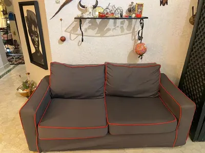 a leather couch sitting in a living room at Penthouse Jaccuzi Atlas Marrakech in Marrakech