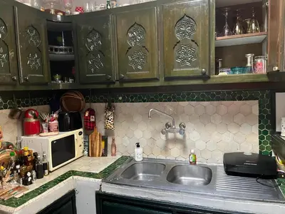 a kitchen with a sink and a microwave at Penthouse Jaccuzi Atlas Marrakech in Marrakech