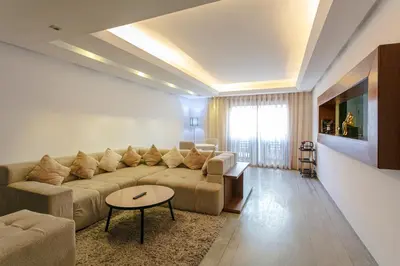 a living room with a couch and a table at The Gallery Suite – Marrakech Centre in Marrakech