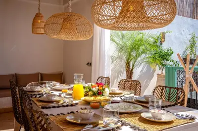 a dining room table with plates of food on it at Riad Bella Kasbah in Marrakech