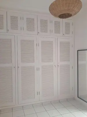 a room with white cabinets and a ceiling at Riad Sun and Swim Marrakech in Marrakech