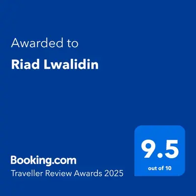 a blue text box with the words awarded to rid wavaliki at Riad Lwalidin in Marrakech