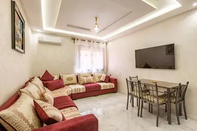 a living room with a couch and a table at Vittoria Guest House Marrakech in Marrakech