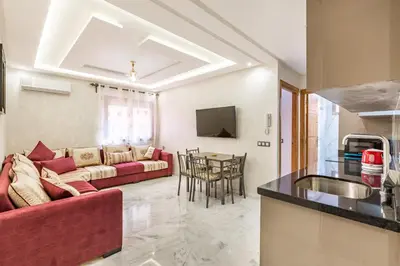 a living room with a couch and a table at Vittoria Guest House Marrakech in Marrakech