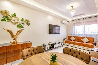 a living room with a couch and a table at Vittoria Guest House Marrakech in Marrakech