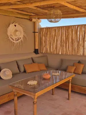 a living room with a couch and a table at Riad Casa Dolce Marrakech Médina in Marrakech