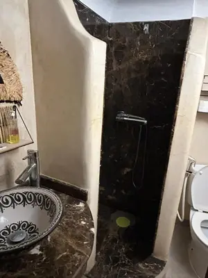 a bathroom with a sink and a toilet at Riad Amazing Amazigh avec jacuzzi petit déjeuner compris avec aussi chambres familiales près de la place jemaa El fna in Marrakech