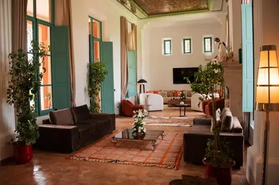 a large living room with couches and plants at Villa Prestige Mansourya in Marrakech