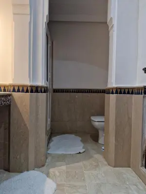 a bathroom with a toilet and a sink at Appartement babylon 2 marrakech in Marrakech