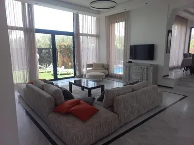 a living room with a couch and a table at H Amelkis in Marrakech