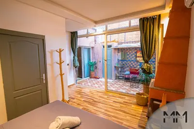 a room with a door open to a living room at MA Studio in Marrakech