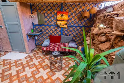 a small room with a bed in a wall at MA Studio in Marrakech