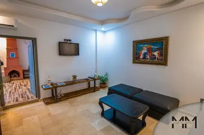 a living room with a couch and a tv at MA Studio in Marrakech