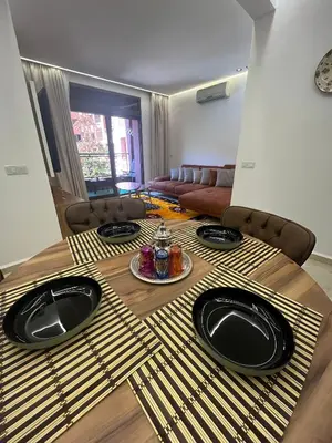 a dining room table with a table cloth on it at Premium Hivernage Amazigh 2BR Flat - Zayane Homes in Marrakech