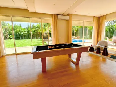 a large room with a pool table in a house at Villa Marrakech, 15 min from center, Disco, Hammam in Marrakech