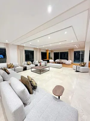 a large living room with white couches and tables at Villa Marrakech, 15 min from center, Disco, Hammam in Marrakech