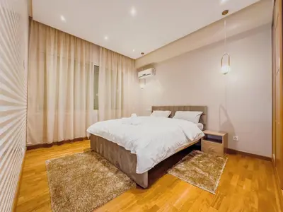 a bedroom with a large bed and a large window at Villa Marrakech, 15 min from center, Disco, Hammam in Marrakech