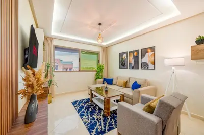 a living room with a couch and a table at Cozy Studio with Mountain View in Gueliz, Marrakech in Marrakech