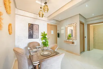 a dining room with a table and chairs at Cozy Studio with Mountain View in Gueliz, Marrakech in Marrakech