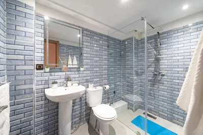 a bathroom with a toilet and a sink and a shower at Cozy Studio with Mountain View in Gueliz, Marrakech in Marrakech