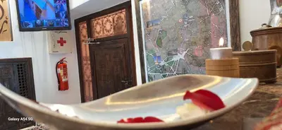 a bowl with food in it on a table at Hostel Dar Ben Youssef in Marrakech