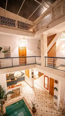 a large room with a pool in the middle at Riad Marssa, Privé Zen avec belle piscine dans la Médina in Marrakech