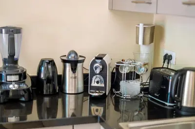 a counter top with various appliances on it at Villa beldi chic Amelkis golf in Marrakech