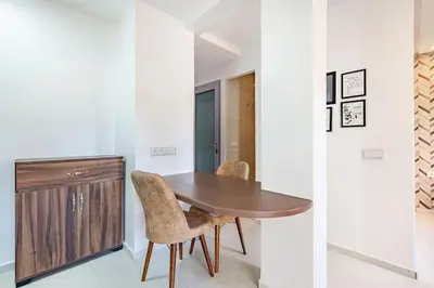 a dining room with a wooden table and chairs at New! Chic studio, centrale Guéliz Carré Éden in Marrakech