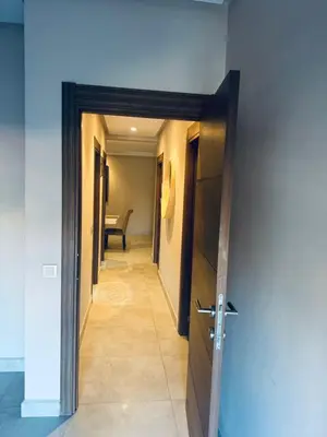 a hallway with a door leading into a room at Superbe appart au centre de gueliz in Marrakech