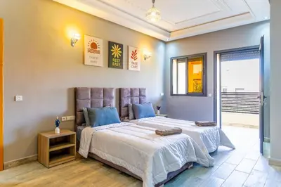 a bedroom with a large bed and a window at Peaceful Marrakech Villa 4 Bedrooms Private Pool in Marrakech