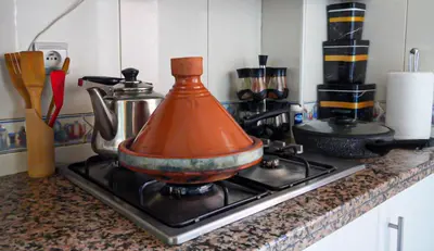 a pot sitting on top of a stove at Stylish Moroccan Apartment Near Majorelle Garden, Wi-Fi, Free Airport Shuttle in Marrakech