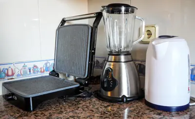 a blender sitting on top of a counter next to a appliance at Stylish Moroccan Apartment Near Majorelle Garden, Wi-Fi, Free Airport Shuttle in Marrakech