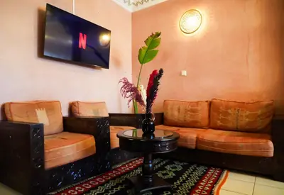 a living room with a couch and two chairs at Stylish Moroccan Apartment Near Majorelle Garden, Wi-Fi, Free Airport Shuttle in Marrakech