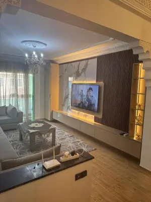 a living room with a couch and a table at Charming Two-Bedroom Apartment in Marrakesh Gueliz in Marrakech
