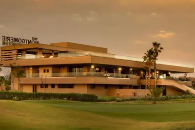 a building with a golf course in front of it at Luxurious Apartment Marrakech with Pool, Golf, Private Garden in Marrakech