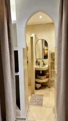 a bathroom with a sink and a mirror at Private Riad 4 Bedrooms With Free Breakfast and Heated Plunge Pool in Marrakech