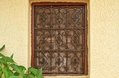 a metal door on the side of a building at Riad ELIZZI in Marrakech