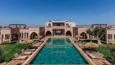 an image of a villa with a swimming pool and chairs at Luxury Villa Rêve D'ahlam à MARRAKECH in Oulad Boudene