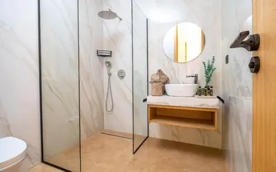 a bathroom with a shower and a sink at Villa ZINA I Luxe I Piscine chauffée I Wifi I Proche centre Ville in Marrakech