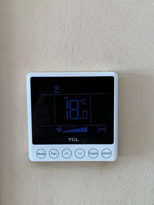 a digital clock on a wall on a wall at Elegant Apartment with Pool, Clim & Wi-Fi - 7min Gueliz in Marrakech