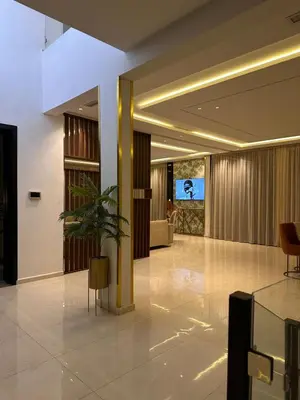 a lobby with a yellow column in a building at villa 105 golf noria piscine chauffée in Marrakech