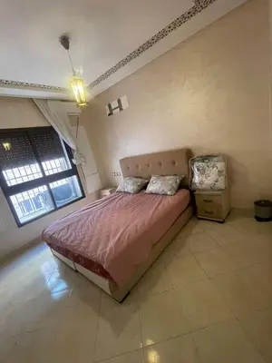 a bedroom with a large bed in a room at Appartement calme près de Gueliz Marrakech in Marrakech