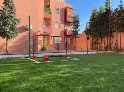 a soccer ball on a field in front of a building at Marrakech top 1 in Marrakech