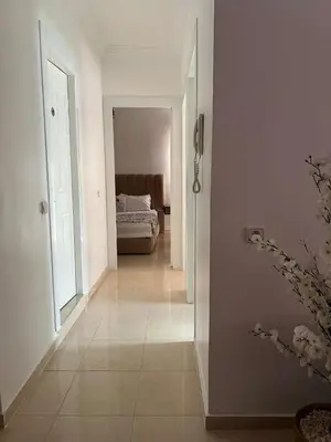 a hallway leading to a bedroom with a bed in it at Marrakech top 1 in Marrakech