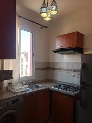 a kitchen with a sink and a stove and a window at Marrakesh 3 Bedroom Oasis in Marrakech