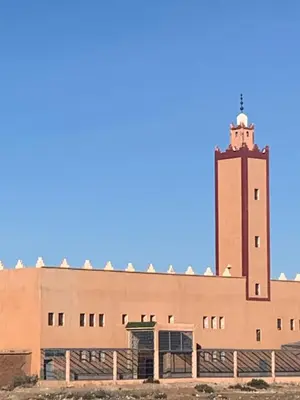 a building with a clock tower on top of it at Step into our little oasis in Marrakech