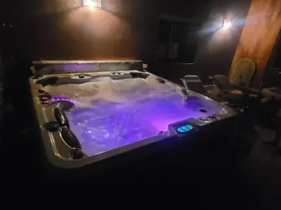 a large bath tub filled with purple water at MELBARI Cosy-Appart in Marrakech
