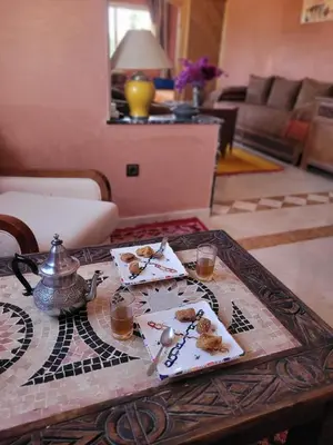 a table with a tea set on top of it at MELBARI Cosy-Appart in Marrakech
